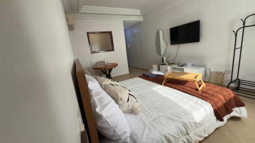 Una cama o camas en una habitación de Charming City Retreat in Agdal- Walk to Arribat Center & Train