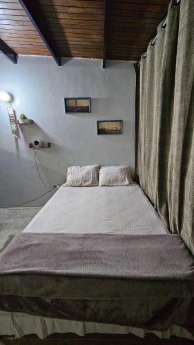 Ένα ή περισσότερα κρεβάτια σε δωμάτιο στο Hermoso Estudio Alto Barinas