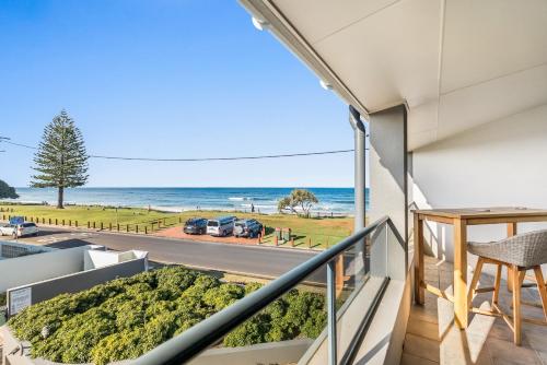 a balcony with a view of the ocean at Sea Breeze - Lennox Head in Lennox Head