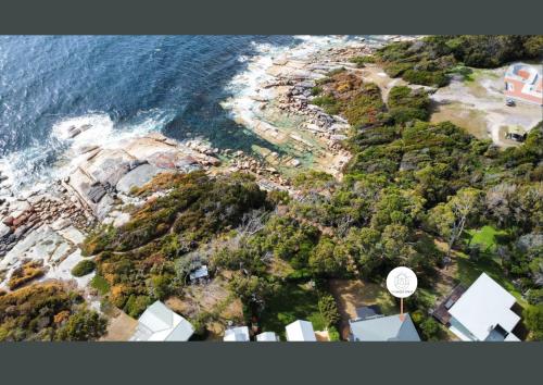 an aerial view of a beach and the ocean at Total ~ Allure ~ in Bicheno