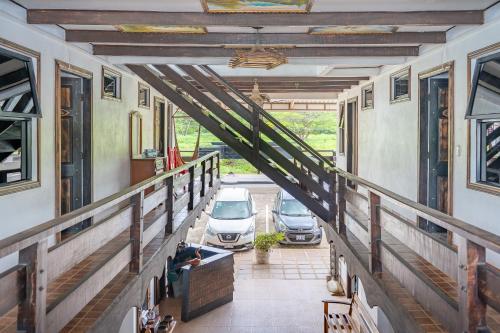 a view from the balcony of a building with cars parked at Hotel El Baquiano in Tamarindo