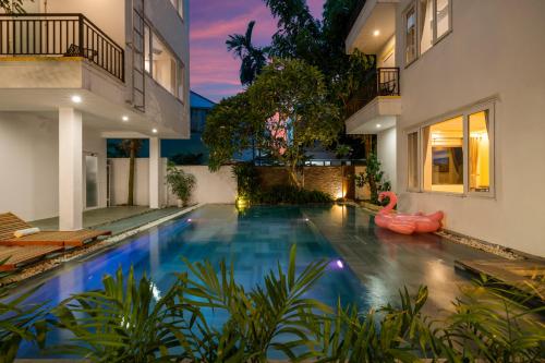 a swimming pool in the backyard of a house at Numa Villa Near Old Town Hoi An in Hoi An
