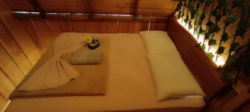 a room with a couch with a dress and a window at Amazon Private Tours Jungle Lodge in Manacapuru