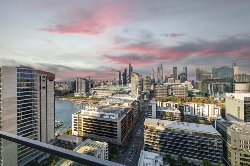 a view of a city skyline with buildings at Docklands Harbour & City Views Pool, Free Onsite Parking , Yoga & Gym in Melbourne