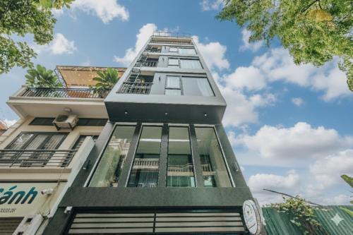 a tall building with glass windows on the side at Crescendo Limitless Style in Hanoi