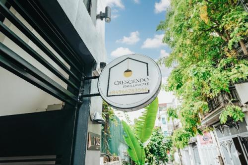 a sign for a restaurant on the side of a building at Crescendo Limitless Style in Hanoi