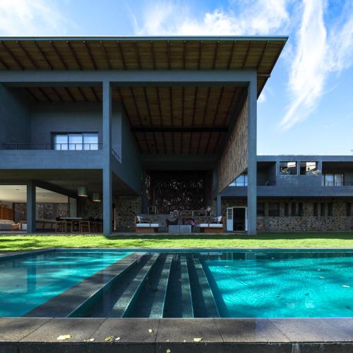 an external view of a house with a swimming pool at Kurundu House in Digana