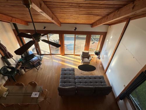 an overhead view of a living room with a couch and chairs at CabinC Private Fireplace, BBQ, Lake Saiko MtFuji in Narusawa