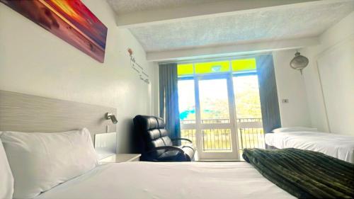 Postel nebo postele na pokoji v ubytování Le George Motel