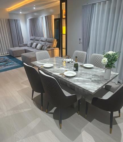 a dining room with a table and chairs at Norden Barn B&B in Chiang Mai