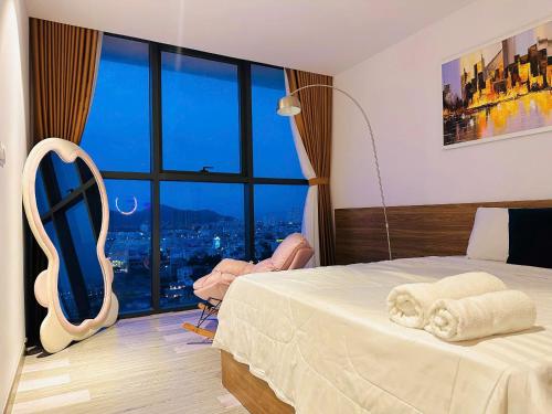 Letto o letti in una camera di CSJ Seaside - Căn Hộ Cạnh Biển