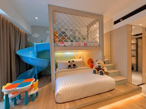 a childs bedroom with a bed with a mirror at FortunaSuites Malioboro Yogyakarta in Sentool