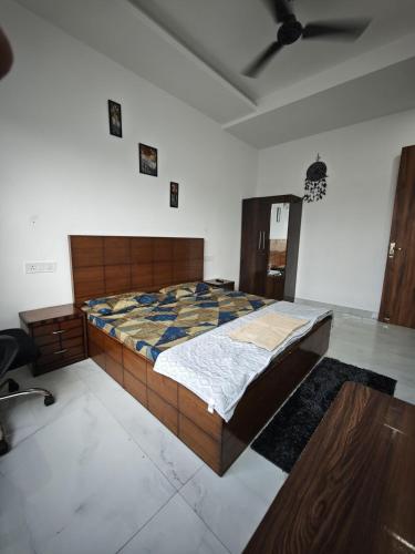 a bedroom with a large bed in a room at 2BHK Apartment at Oxford Street, Zirakpur in Panchkula
