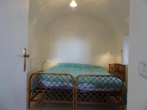 A bed or beds in a room at Torrione San Giovanni II