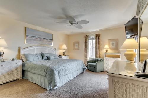 a bedroom with a bed and a ceiling fan at Anchorage II B04 in Myrtle Beach