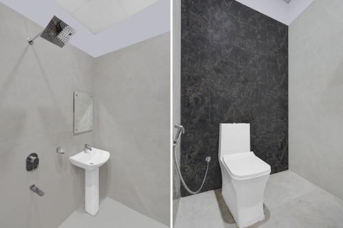 a bathroom with a toilet and a sink at Hotel O THE GOMTI GLITZ in Gomti Nagar