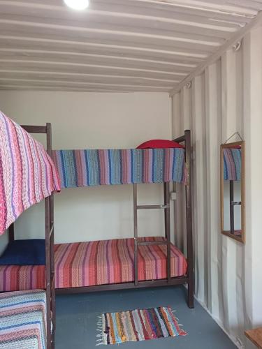 Postel nebo postele na pokoji v ubytování A Casa Raiz Containers