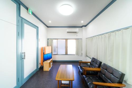 a conference room with chairs and a table and a tv at INARI - Vacation STAY 87349 in Takamatsu