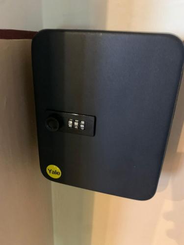 a black box with a sticker on a wall at Apartament Crăciunița in Timişoara