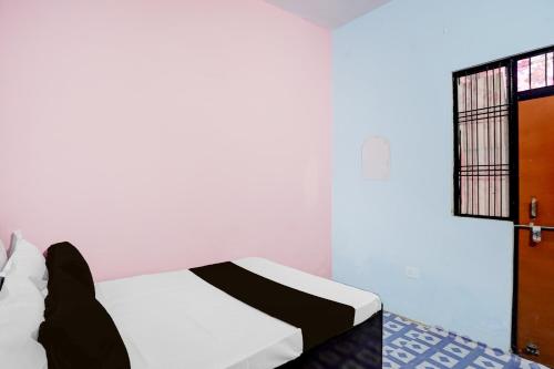 Postel nebo postele na pokoji v ubytování Hotel O Jannat Galaxy