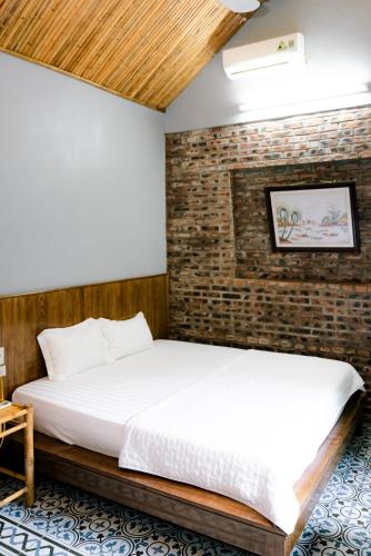 Postel nebo postele na pokoji v ubytování Tam Coc Lakeside Homestay