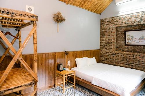 Postel nebo postele na pokoji v ubytování Tam Coc Lakeside Homestay