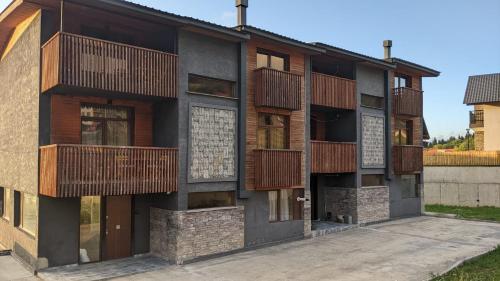 a building with balconies on the side of it at Gio gio in Bakuriani