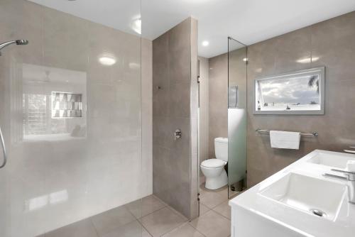a bathroom with a shower and a sink and a toilet at 'Perfect Pool House' Idyllic Tropical Retreat in Edge Hill