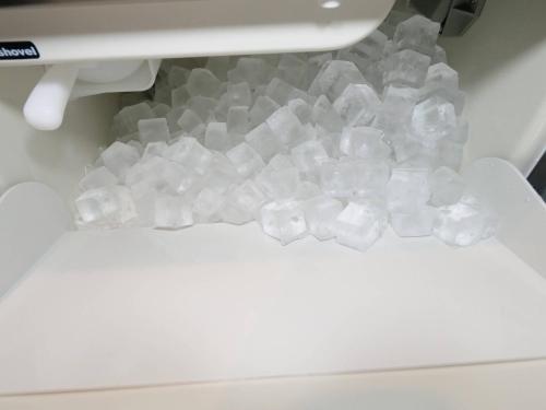 a pile of ice cubes in a washing machine at TOTONOU Awajishima in Awaji