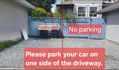a no parking sign in front of a driveway at Private basement suite in Langley