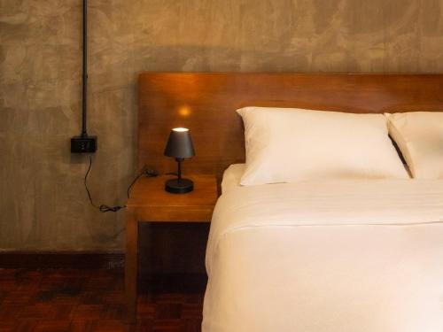 Ένα ή περισσότερα κρεβάτια σε δωμάτιο στο Lanna Loft Hostel