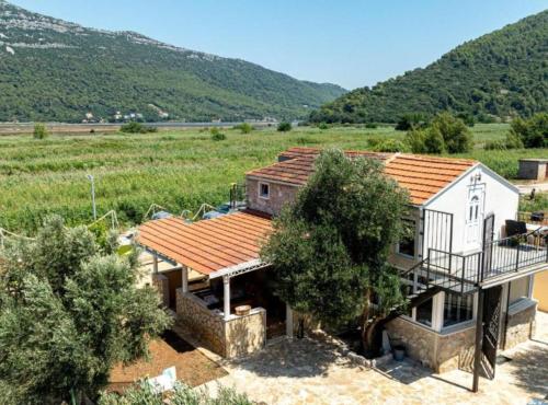 an image of a house in a field at Natur Olive House Ston in Ston