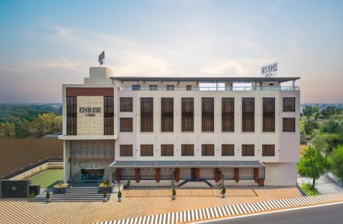 a large white building with a bird on top of it at Enrise by Sayaji, Vidisha in Vidisha