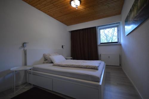 Ένα ή περισσότερα κρεβάτια σε δωμάτιο στο Gästehaus Elena