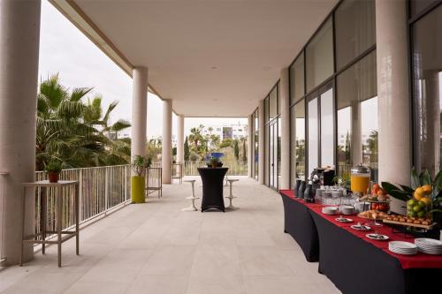 a hotel hallway with a buffet of food on a table at Higuerón Hotel Curio Collection by Hilton in Fuengirola