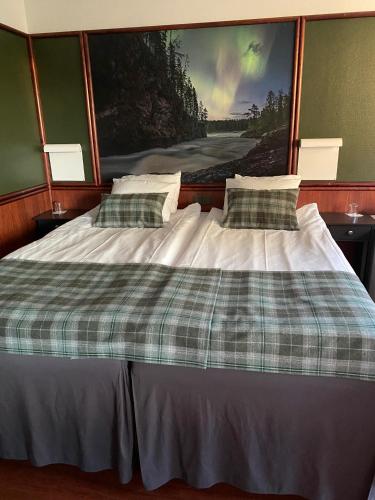 Katil atau katil-katil dalam bilik di Hotel Royal Ruka