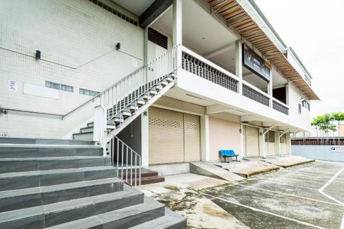 a building with stairs in a parking lot at XX At Gate Suvarnabhumi Airport in Lat Krabang