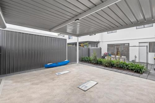 an outdoor patio with awning on a house at Waterside in Victor Harbor