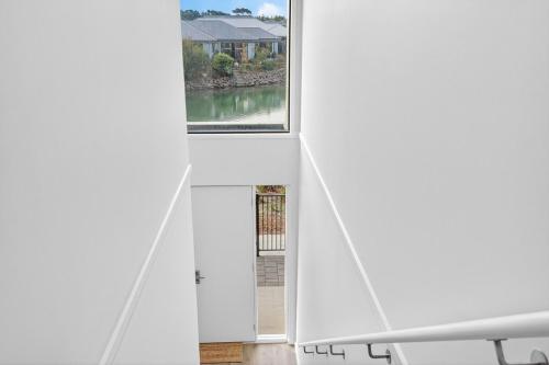 a view from inside a white room with a window at Waterside in Victor Harbor