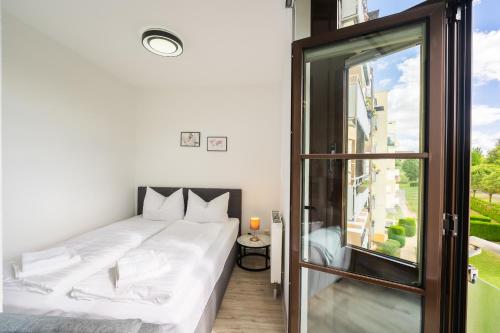 Katil atau katil-katil dalam bilik di Ferienwohnung in Gera Lisa, Sehr ruhige Lage, Blick ins Grüne, Hochwertig renoviert, WLAN und Parkplatz GRATIS