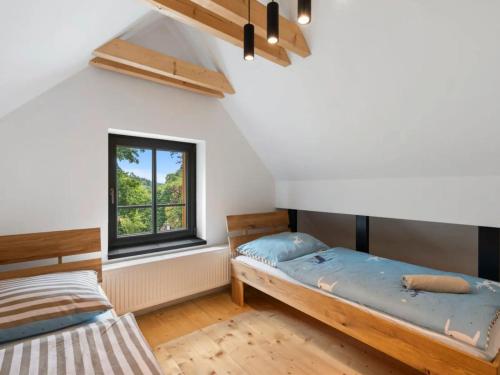 Postel nebo postele na pokoji v ubytování Apartmány U Buku