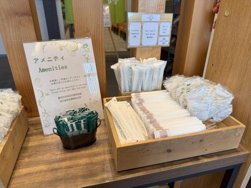 a table with a box of books on it at Hotel La'gent Plaza Hakodate Hokuto in Hokuto