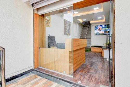 an entrance to a room with a glass door at Super Collection O Aurangabad Shendra MIDC Formerly Prayag Inn in Karmād