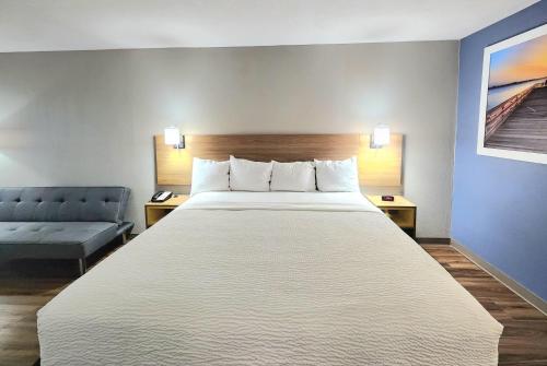 Ένα ή περισσότερα κρεβάτια σε δωμάτιο στο Days Inn by Wyndham Portland/Corpus Christi