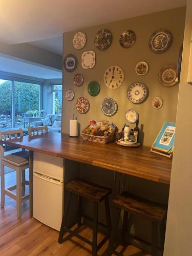 a room with a counter with plates on the wall at Country Cosy Cottage in Bailieborough