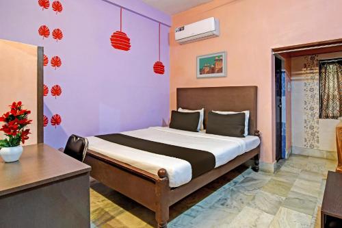 Кровать или кровати в номере Hotel O Chilika Residency