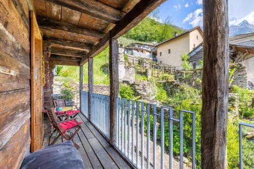 a porch with a view of a mountain at Malvaglia in Malvaglia