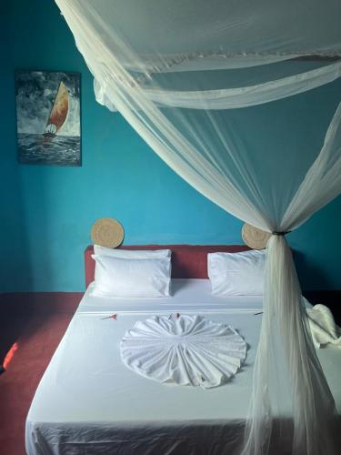 Un ou plusieurs lits dans un hébergement de l'établissement Msafiri House