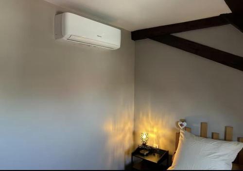 a bedroom with a bed with a white pillow at Heol - La bonne Étoile 