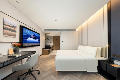 TV a/nebo společenská místnost v ubytování Atour Hotel Zhengzhou Provincial Museum Dongfeng Road